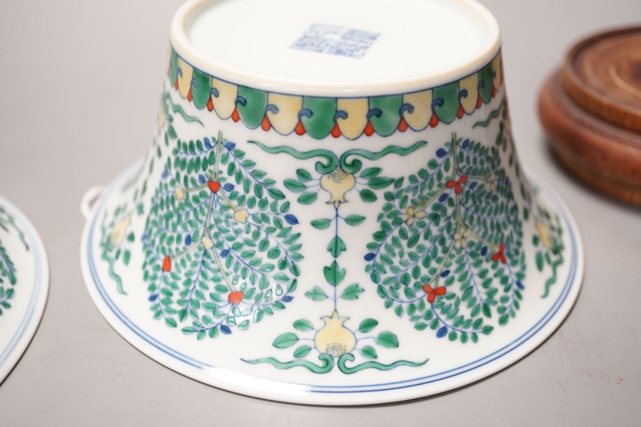 A Chinese blue and white bowl, Kangxi, 15cm. diam., a famille rose teapot stand, Yongzheng, and two doucai bowls